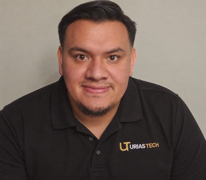 Alfonso Urias, founder of Urias Tech, wearing a black Urias Tech polo shirt